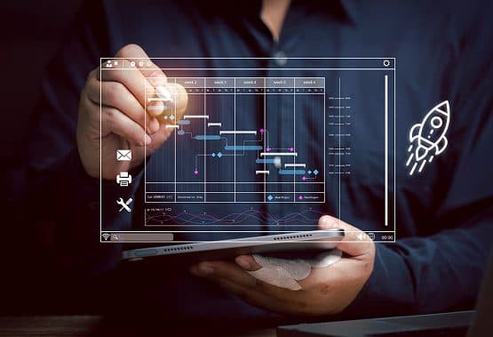 Man holding a tablet displaying a project timeline and rocket launch icon