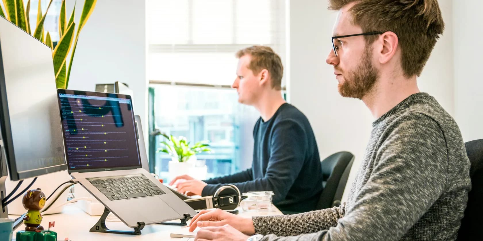 B2B support engineers working through technical tickets at their desks